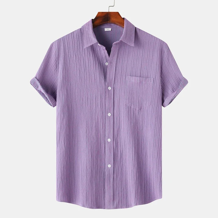 Men's lightweight coastal button-down shirt. Classic fit, short-sleeve, ideal for summer casual & resort wear.