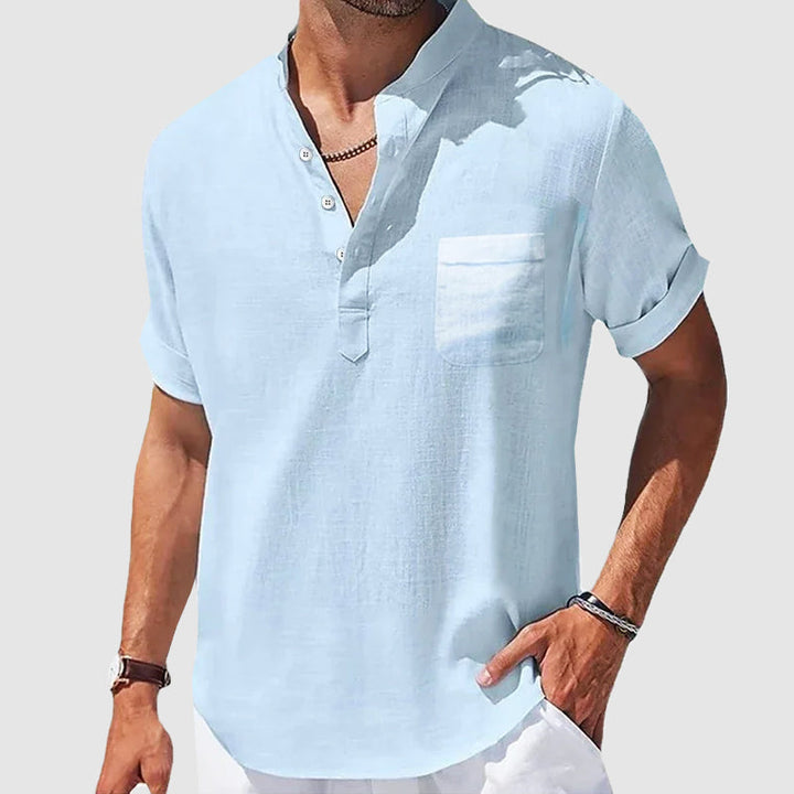 Light blue men's henley shirt. Relaxed fit, short sleeve, button placket, perfect casual summer top.