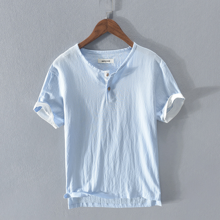 Men's stylish white lightweight Henley shirt, a breathable short sleeve top for comfortable summer casual fashion.