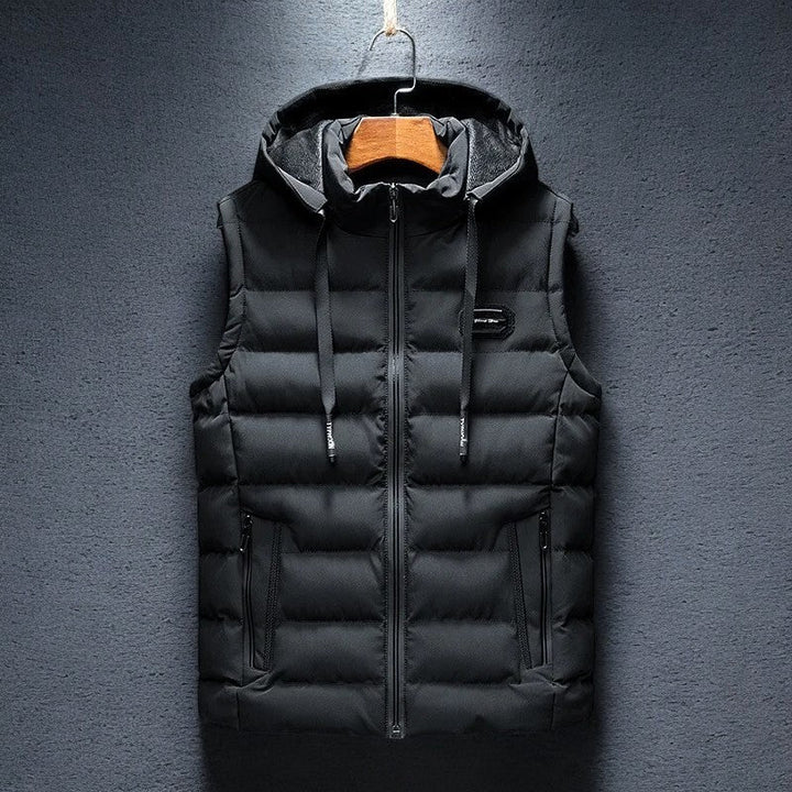 Warm men's sleeveless insulated jacket. This hooded puffer vest is great for layering in cold weather or activewear.