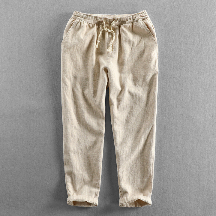 Men's lightweight linen drawstring trousers for a relaxed, breathable summer look.