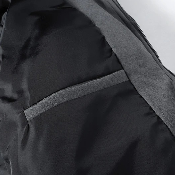 Man wearing a versatile men's lightweight puffer jacket, perfect for casual fall outdoor activities & warmth.
