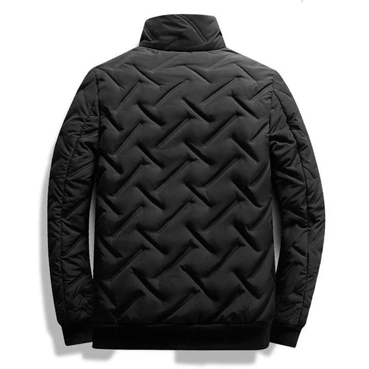 Casual men's quilted jacket worn for a stylish, comfortable everyday look in versatile fall fashion.