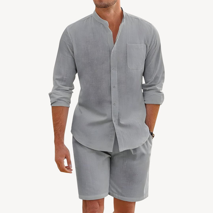 Men's summer shirt and shorts two-piece set. Features a casual button-up top and comfortable drawstring shorts.