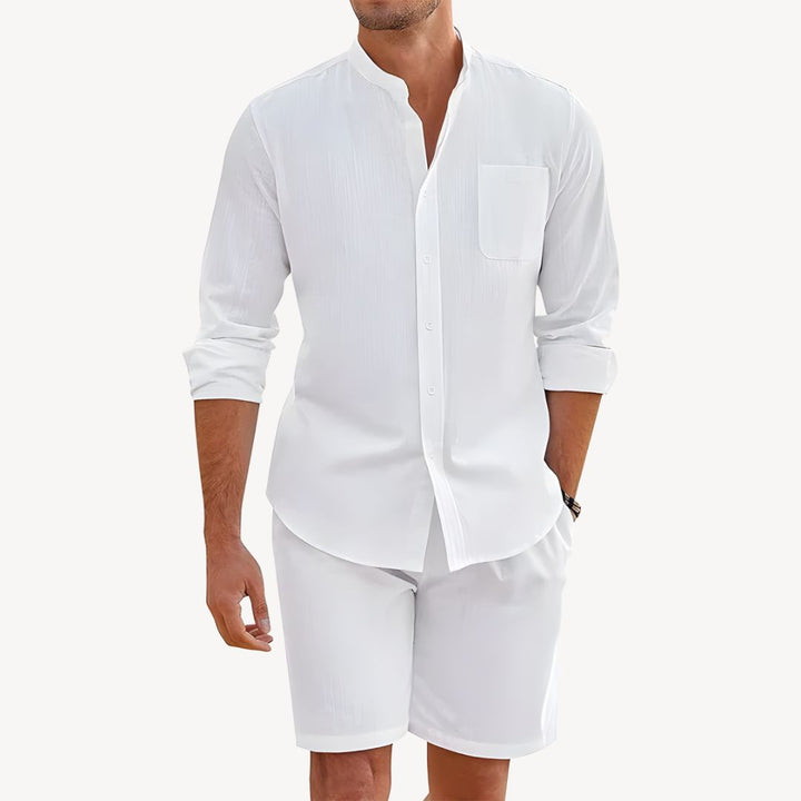 Men's vacation clothes: lightweight button-up shirt and drawstring shorts. Perfect casual summer outfit for outdoors.