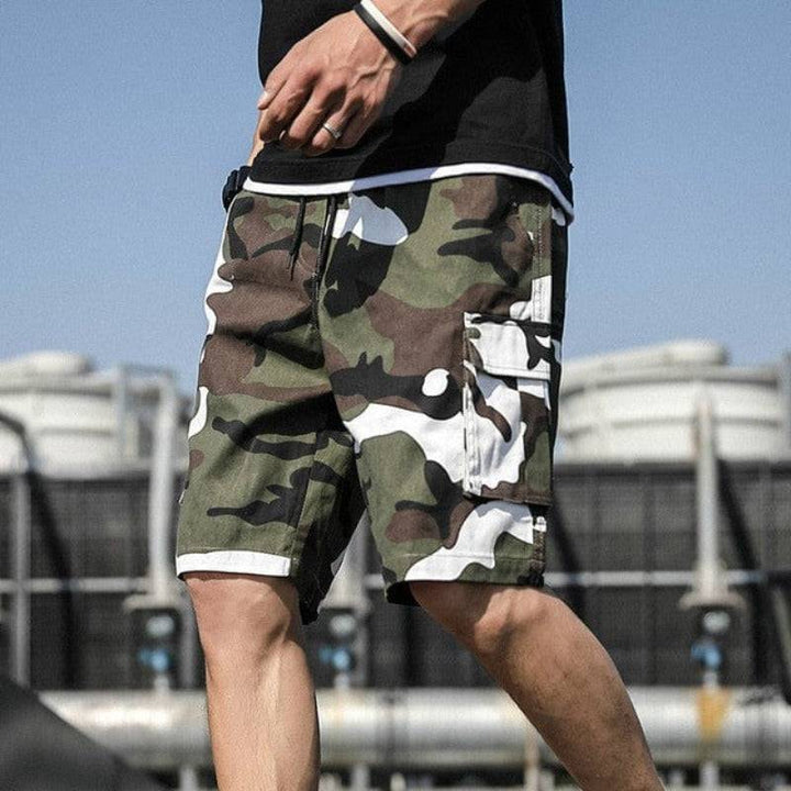 Men's loose fit cotton cargo shorts with drawstring waist, ideal for casual wear.