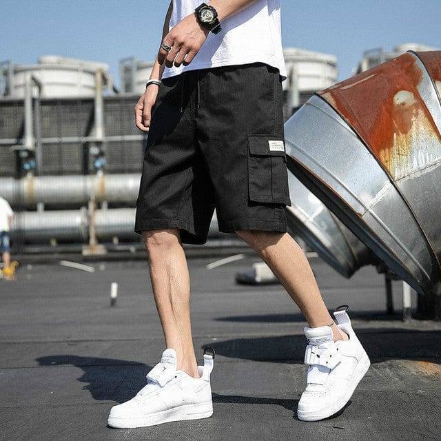 Men's apparel: relaxed fit cotton cargo shorts with an elastic drawstring waist.