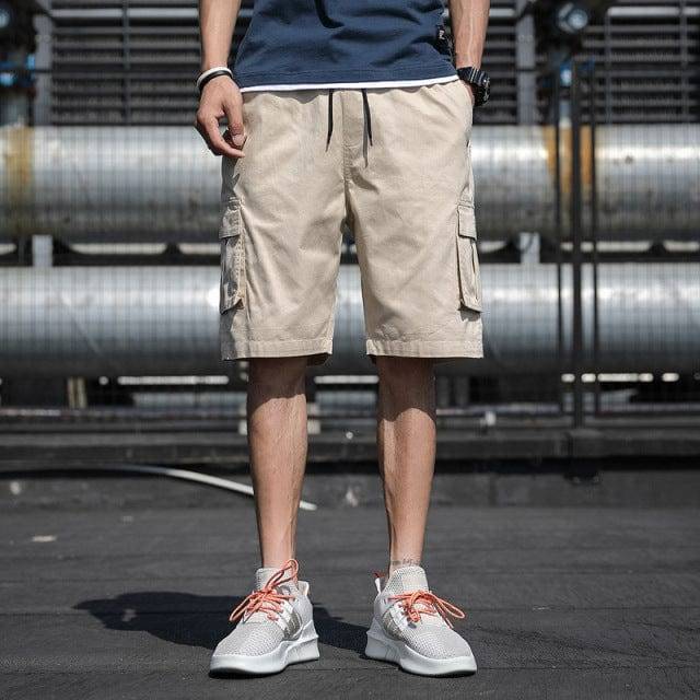Loose fit men's cotton shorts, knee-length design with adjustable drawstring for casual style.