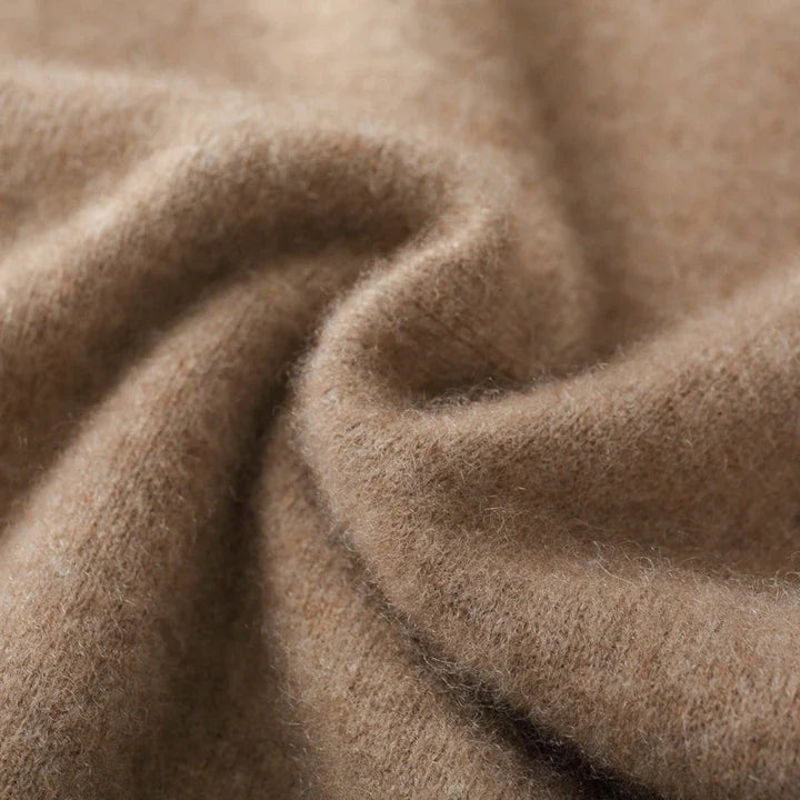 Neatly folded men's luxury cashmere V-neck vest, highlighting its premium quality and softness.