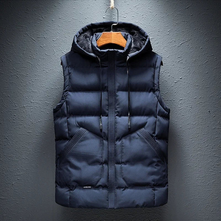 Men's Midtown Hooded Puffer Vest in black. Insulated, lightweight, and weather-ready for autumn & winter layering.