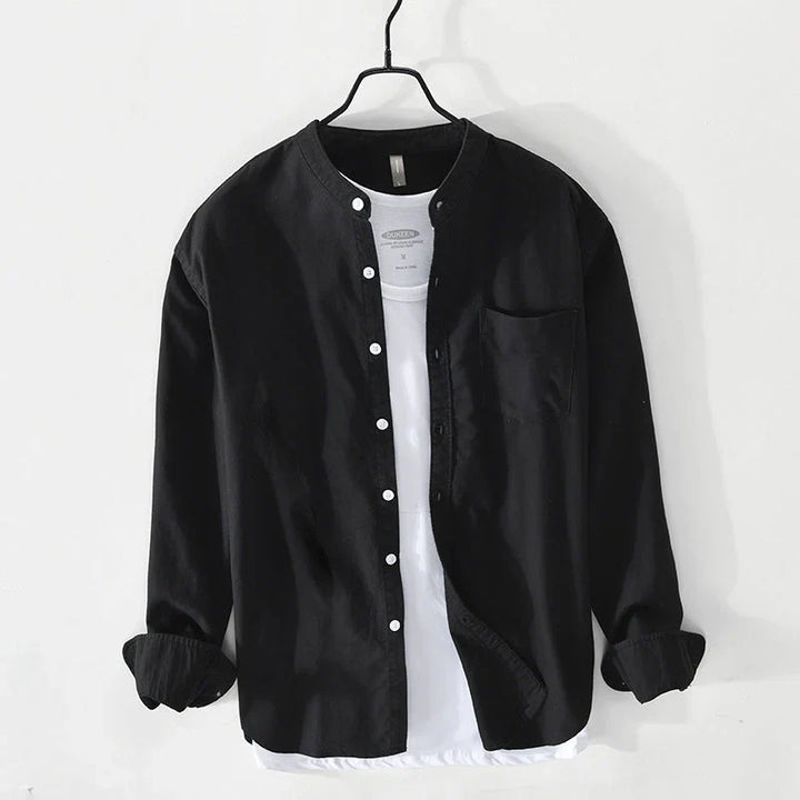 Lightweight men's button-down shirt with a minimalist band collar. Effortless style, relaxed fit for summer comfort.