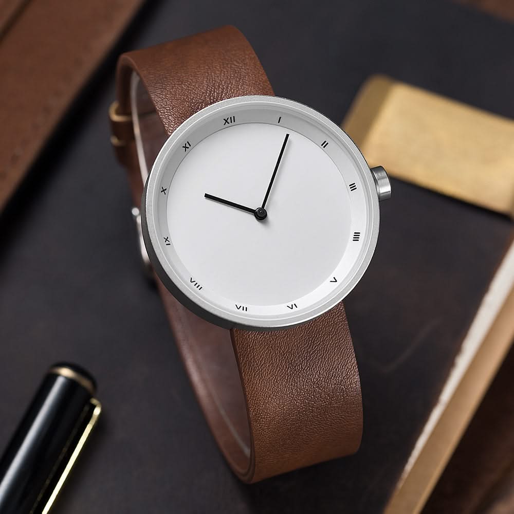 Men's minimalist wrist watch, sleek black dial, modern design, a stylish timepiece.