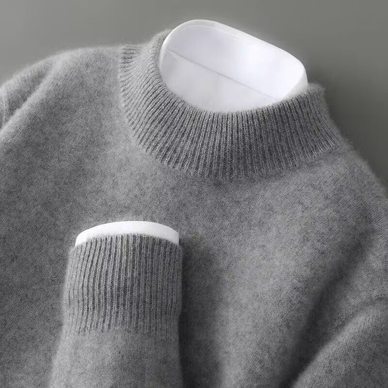 Men's refined mock neck pullover sweater. Comfortable long sleeve design, ideal for autumn & winter elegance.