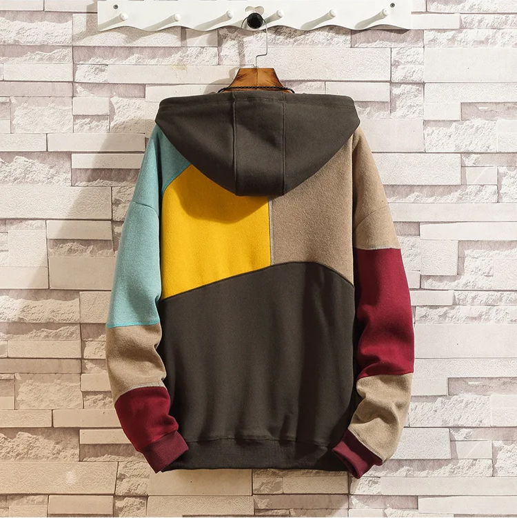 Standout men's patchwork hoodie. Modern pullover with unique fabric panels, offering comfort and streetwear style.