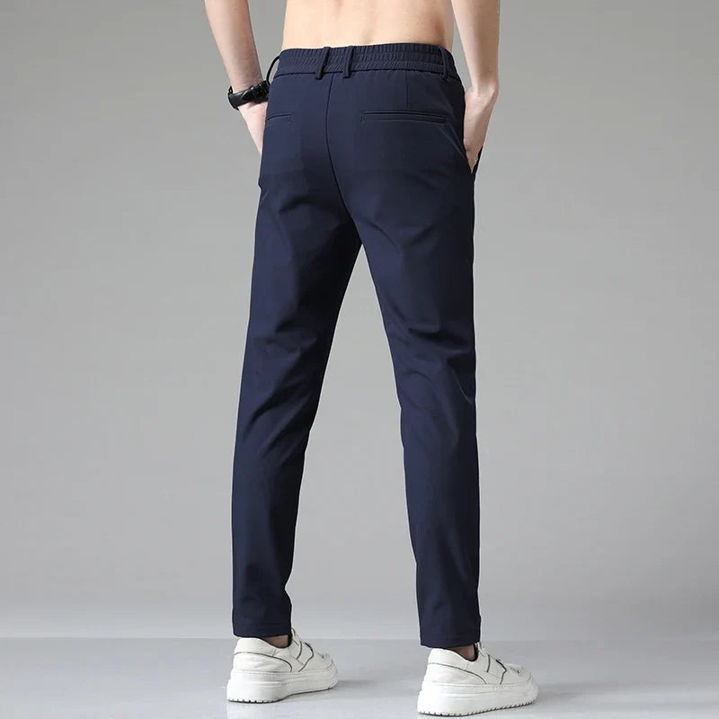 Side view of men's straight leg performance pants, showcasing the modern fit for versatile fashion.