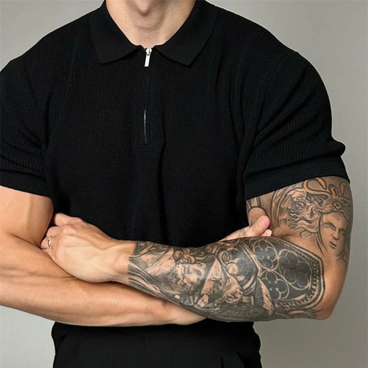 Man wearing a modern tailored fit zip-up polo shirt, comfortable short sleeve knit top for everyday casual style.