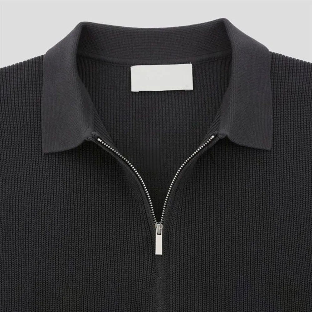 Close-up of men's zip-up polo shirt, tailored fit, showcasing the modern zipper detail and comfortable knit fabric.