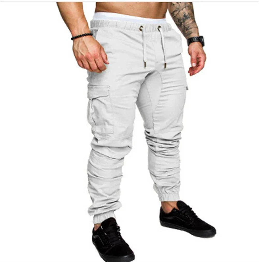Model wearing men's multi-pocket outdoor cargo pants, styled casually for fall, comfortable fit