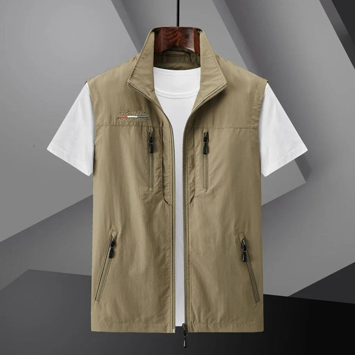 Adventure-ready men's multi-pocket outdoor utility vest for travel, hiking & fishing. Sleeveless.