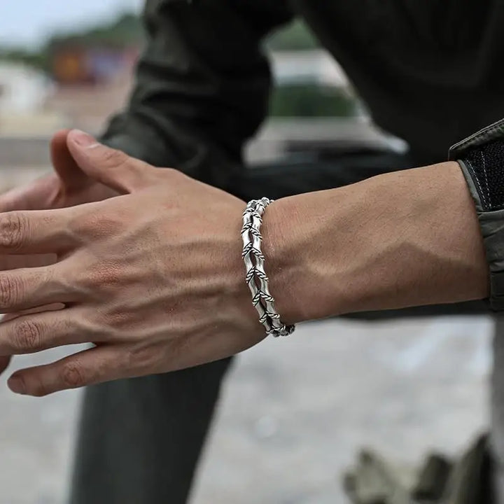 Stylish men's adjustable bracelet featuring natural wood and sleek stainless steel Cuban link design.