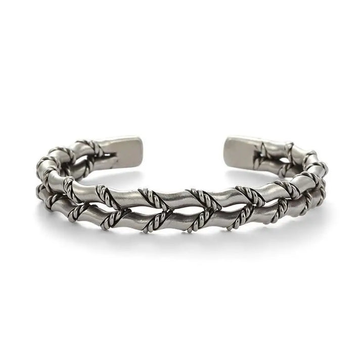 Modern men's accessory: natural wood and stainless steel Cuban link bracelet. Adjustable, durable jewelry.