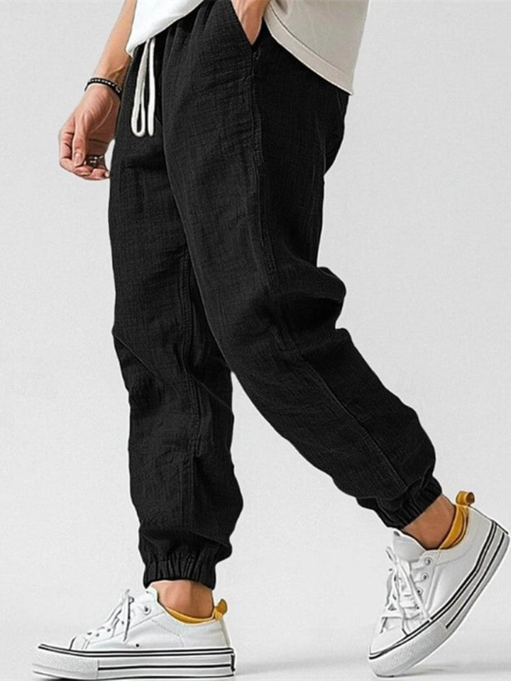 Stylish men's Nomad linen blend joggers, relaxed fit, ideal for comfortable casual summer days.