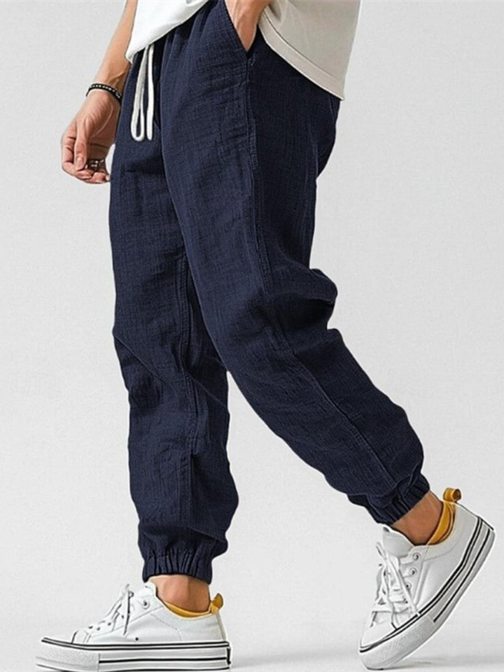 Versatile men's Nomad linen blend joggers, breathable cotton, drawstring, tapered, casual summer.
