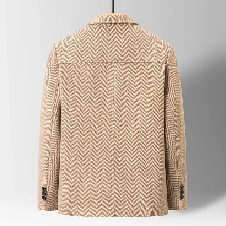 Close-up: Men's Oswald Herringbone Jacket fabric, classic herringbone pattern. Warm, high-quality wool blend.