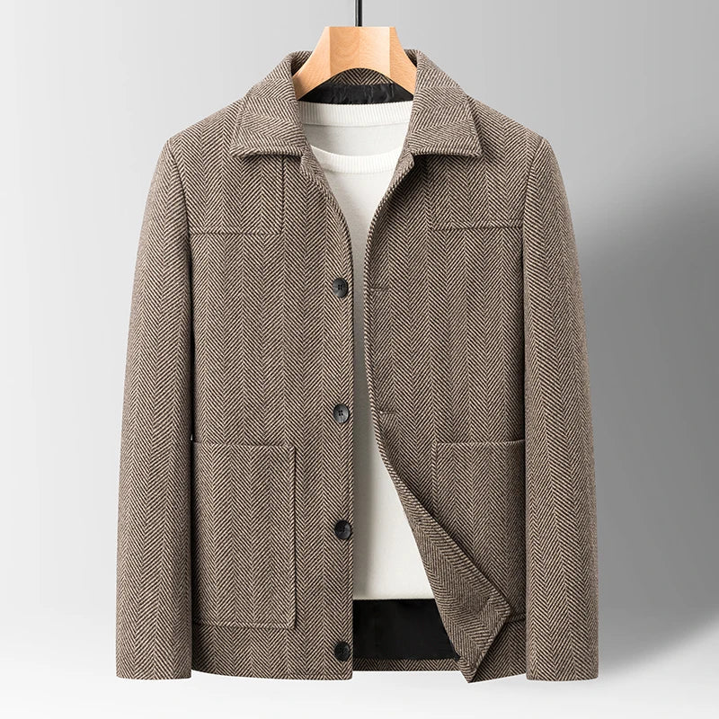 Stylish Men's Oswald Herringbone Jacket paired with jeans. Perfect casual cold-weather fashion for men.