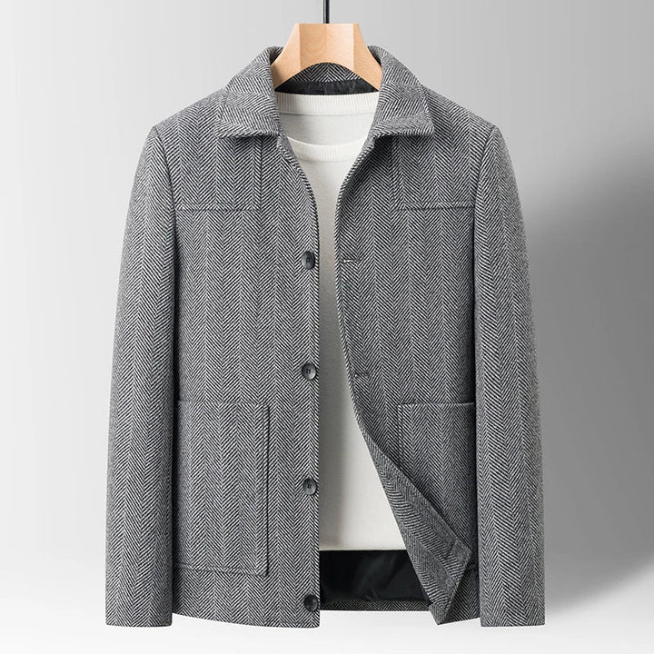 Man in stylish Oswald Herringbone Jacket outdoors. Warm casual winter outerwear for men's cold weather fashion.