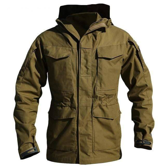 Side profile of a man wearing a tactical hiking jacket with hood, functional outdoor apparel