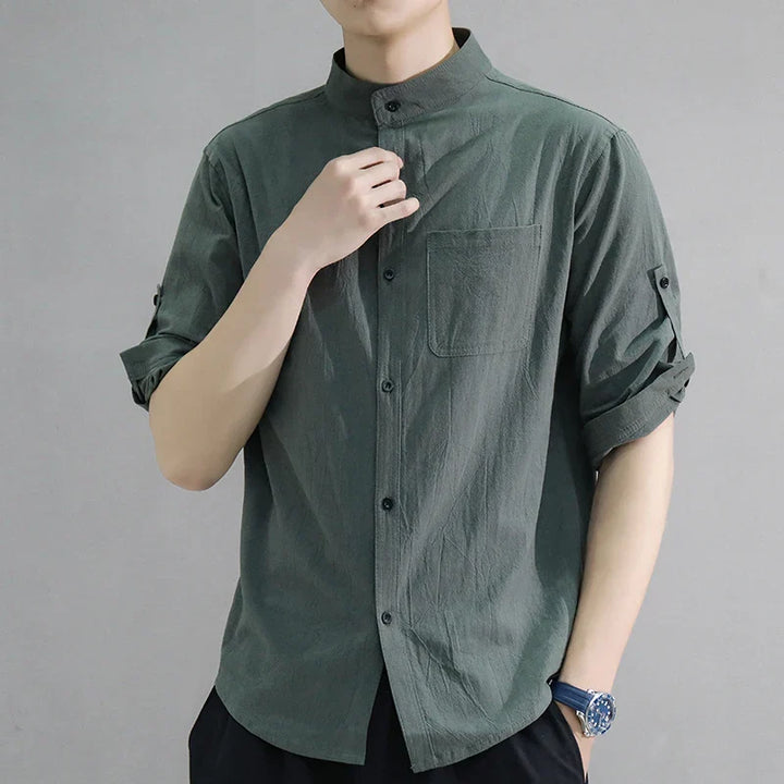 Stylish men's collared half-sleeve shirt, oversized fit for warm weather comfort & modern fashion.