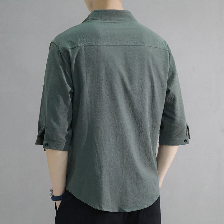 Casual men's oversized half-sleeve collared shirt, designed for warm weather comfort & modern style.