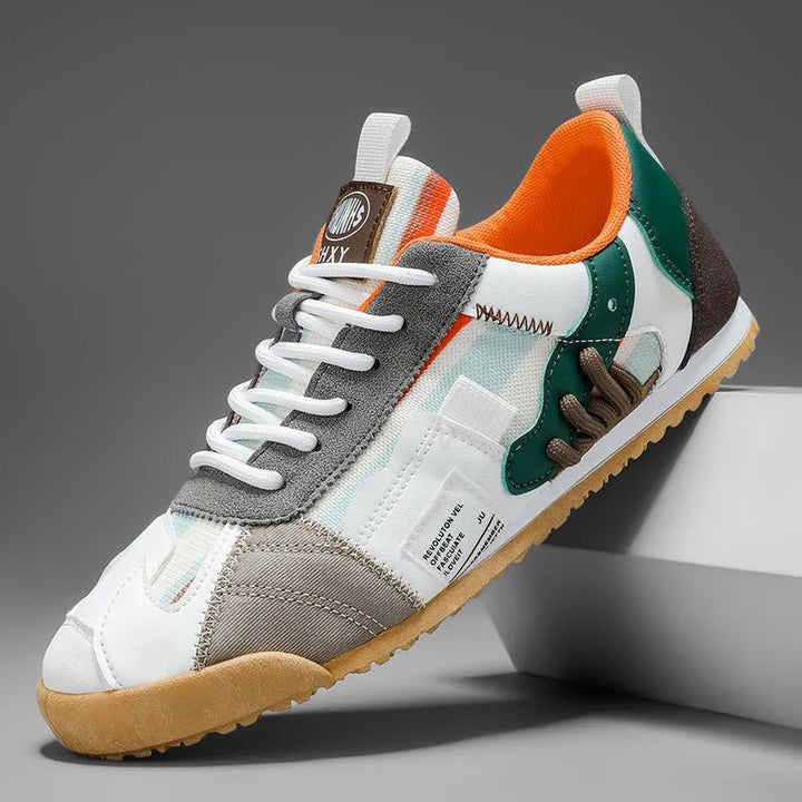 Durable men's patchwork utility sneakers for trail and street. Comfortable everyday footwear for active fashion.