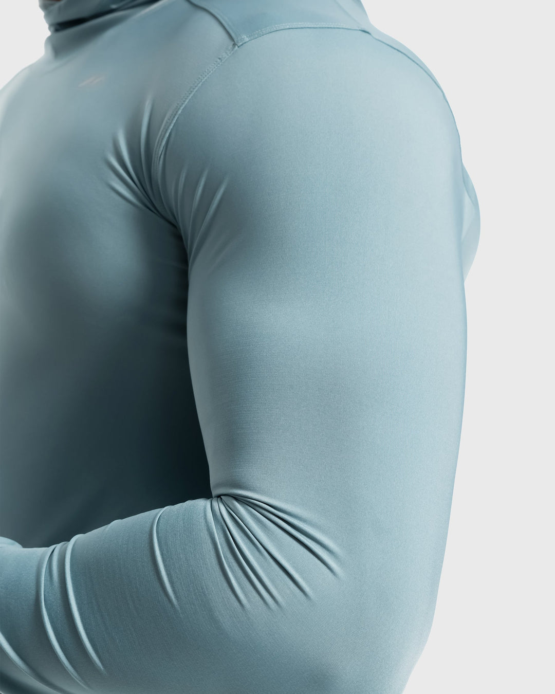 High-performance men's baselayer hoodie, moisture-wicking for intense workouts & running.