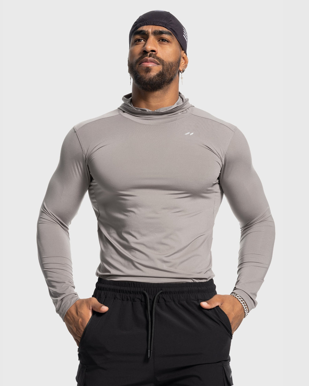 Men's layering piece performance baselayer hoodie for athletic comfort during cold weather workouts.
