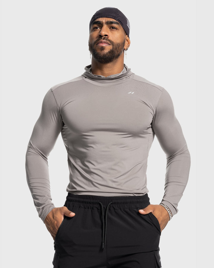 Men's layering piece performance baselayer hoodie for athletic comfort during cold weather workouts.