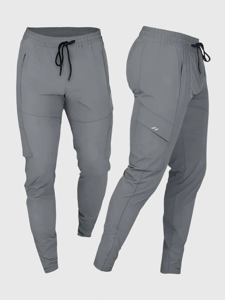 Man running in black quick-dry performance joggers, showcasing flexibility & athletic fit.