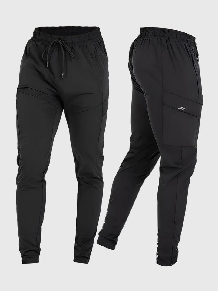Man lounging in comfortable men's stretch activewear joggers, emphasizing relaxation.