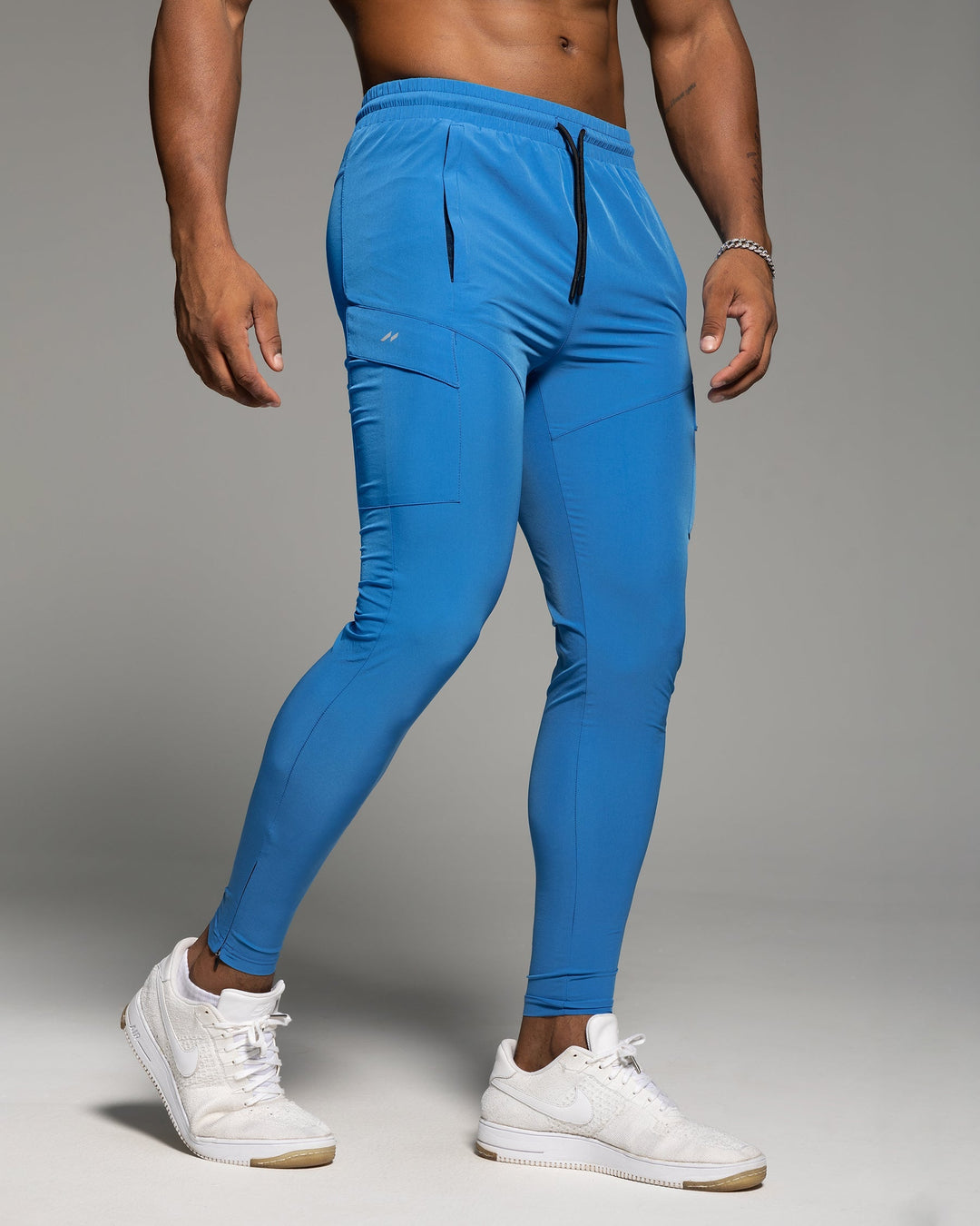 Men's active bottoms: grey tapered joggers, perfect for gym or casual outings.