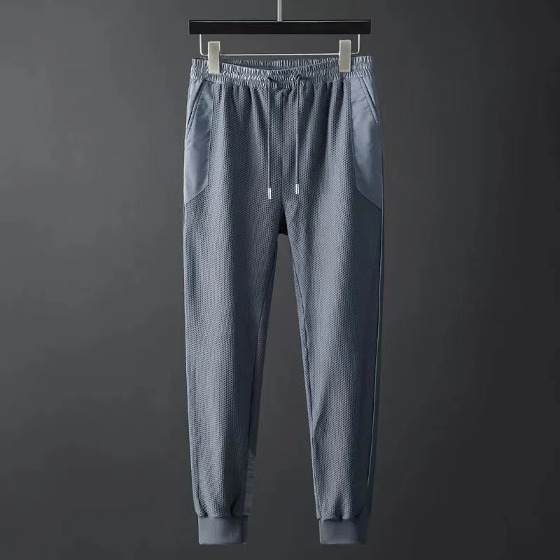 Durable men's athletic tracksuit, performance techwear jogger set. Great for workouts & activewear comfort.