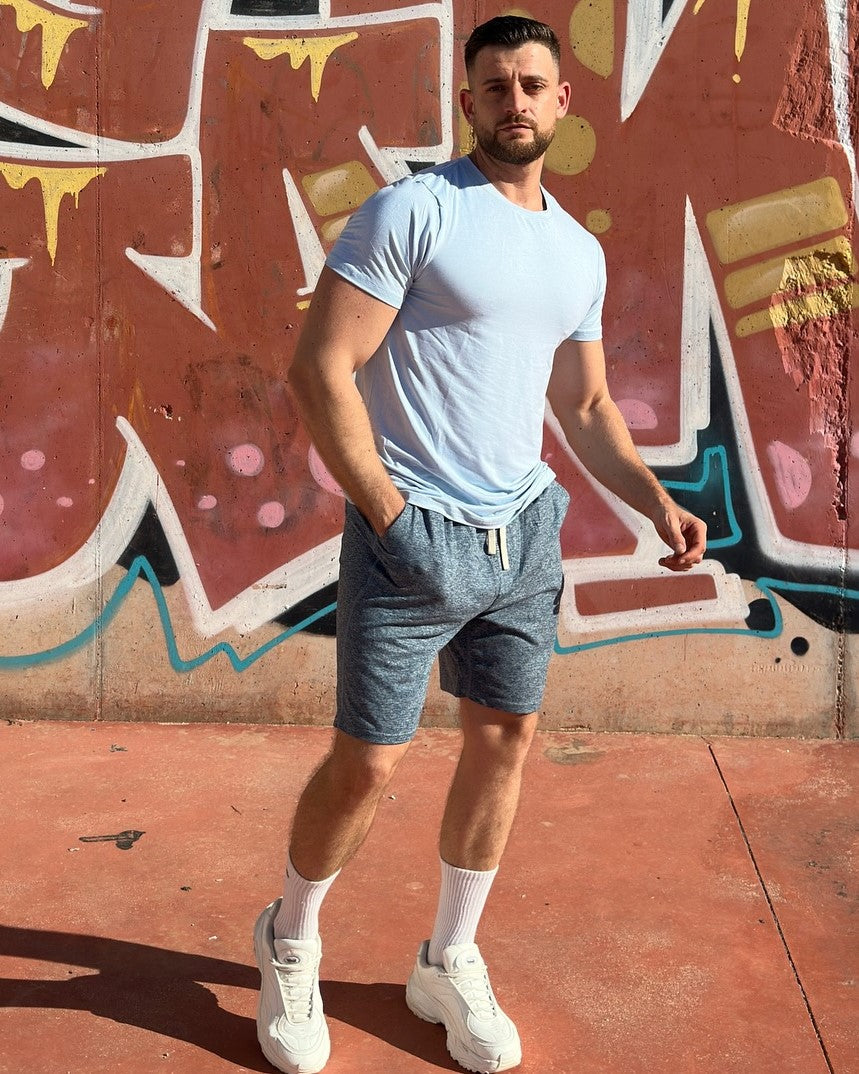 Men's activewear performance shirt, breathable & stretchy for workouts.