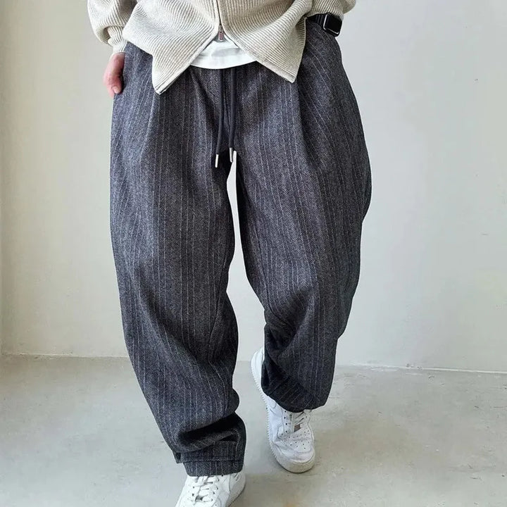 Brown pinstripe drawstring pants for men, designed for a comfortable, relaxed fit perfect for casual wear.