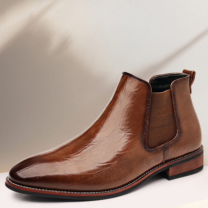 Black polished slip-on Chelsea boots, a comfortable and versatile men's dress shoe.