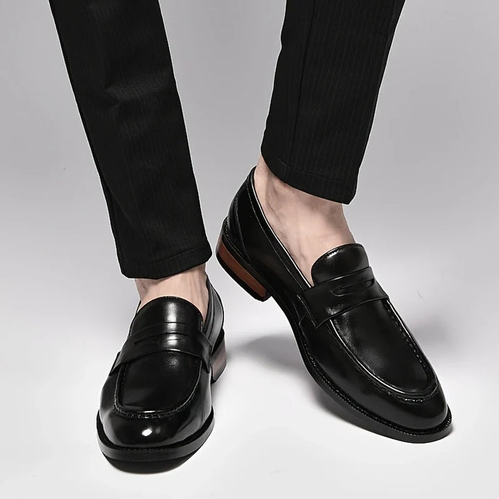 Versatile men's polished slip-on loafers, a classic choice for both business and casual occasions.