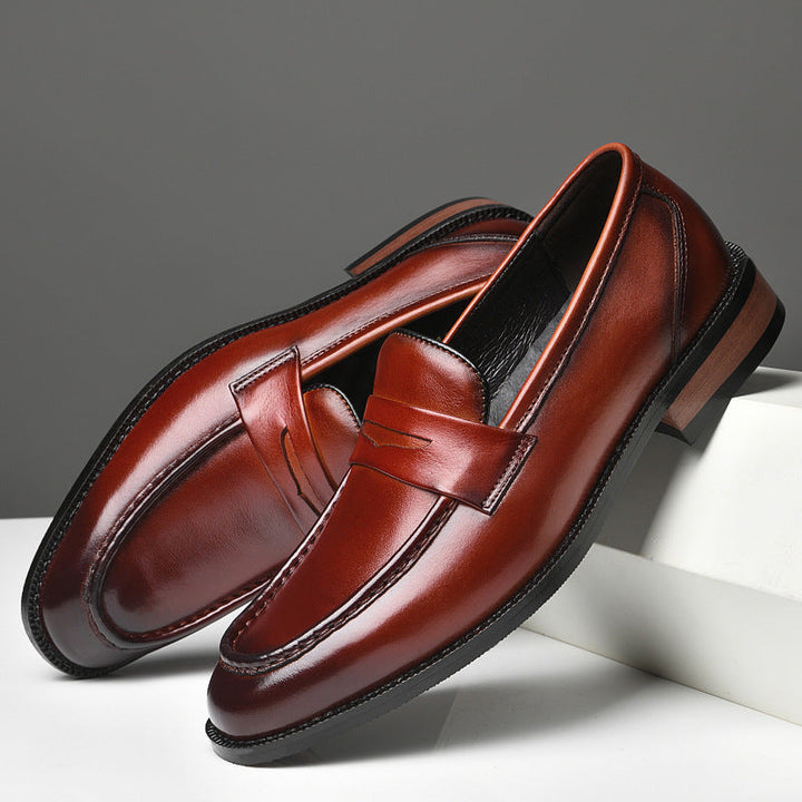 Black polished slip-on loafers for men, sleek design, comfortable & durable dress shoes.