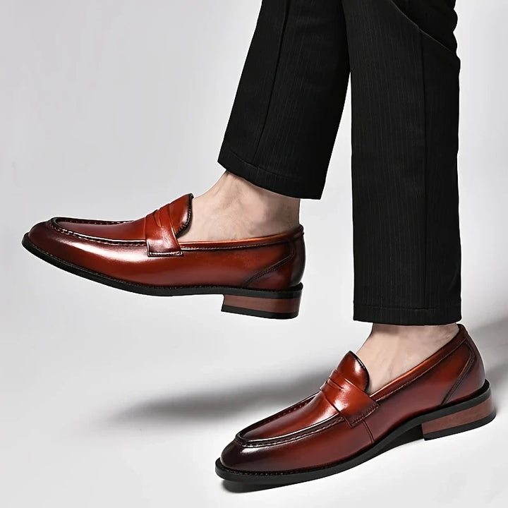 Brown polished slip-on loafers for men, classic style, ideal for formal & everyday wear.