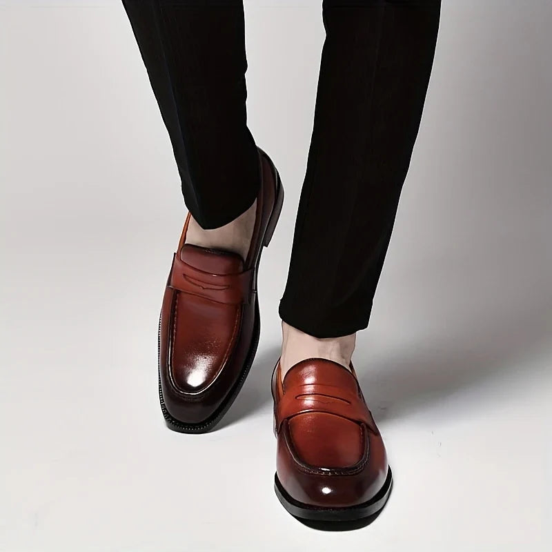 Comfortable men's slip-on loafers with a polished finish, great for dress or casual outfits.