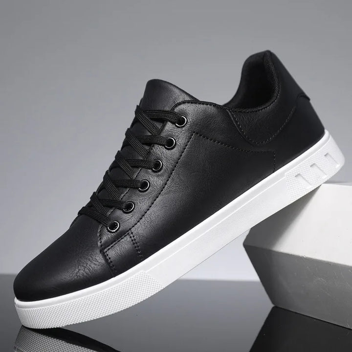 Pair of sleek black men's everyday sneakers, premium comfort versatile casual footwear.