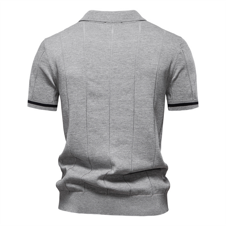Men's quarter-zip polo with structured collar, offering a smart casual look & comfortable fit. Cotton blend.